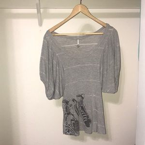 grey striped t shirt with transparent zebra.